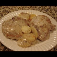 A picture of Porck chops and scalloped potatoes.