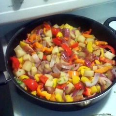 A picture of Kielbasa and veggies.