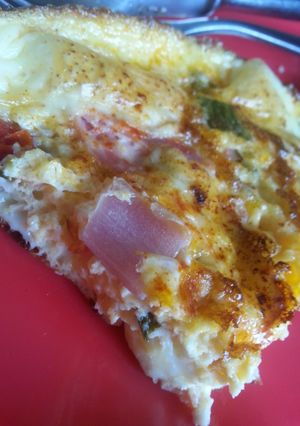 A picture of Salsa and ham Spanish omlette.