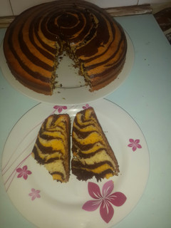 A picture of Zebra cake and rainbow swirl cake.