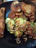 Salmon fillet with persillade potatoes, courgettes and onion