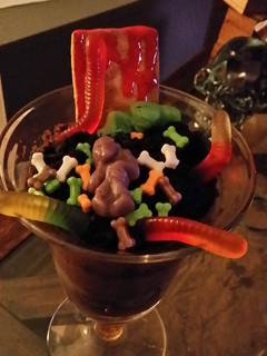 A picture of Zombies & worms in dirt.