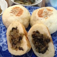 A picture of A Flavor of Shinshū Nozawana Oyaki (Savory Buns Filled With Pickled Greens).