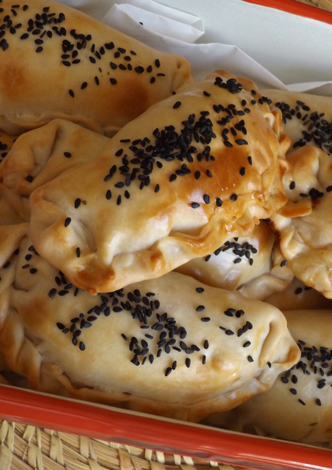 Una foto de Empanadas de ricotta, espinacas y pak-choi