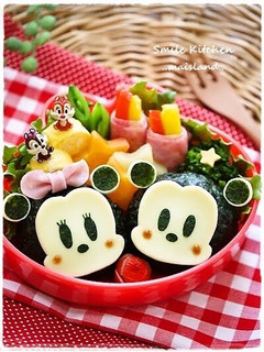 A picture of Mickey and Minnie Onigiri Character Bento.