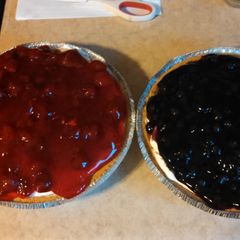 A picture of No bake strawberry and blueberry pies.