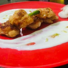 A picture of Prawn cakes with yoghurt honey lemon peel dip.