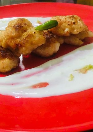 A picture of Prawn cakes with yoghurt honey lemon peel dip.