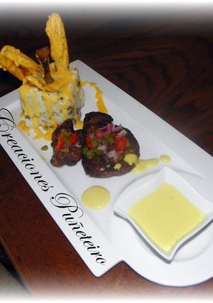 A picture of Meat and Potaoes with Mustard Sause.