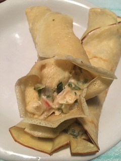 Una foto de Panqueques rellenos con acelga y pollo