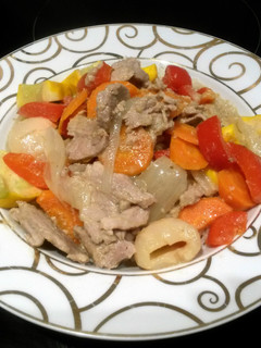 A picture of green thai curry with pork.