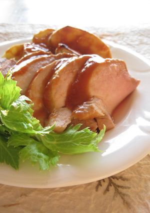 A picture of Roast Pork and Apple with Mustard and Ketchup.