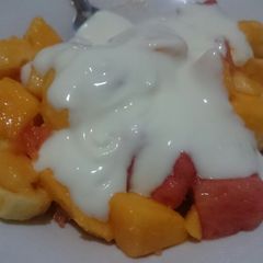 A picture of Fruits and yoghurt salad.