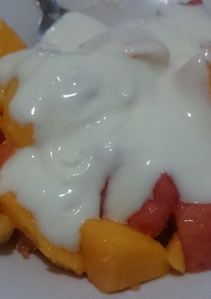 A picture of Fruits and yoghurt salad.