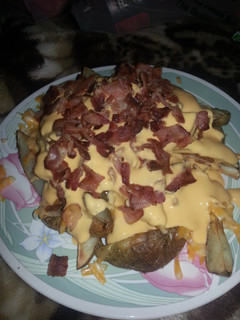 A picture of Cheesy bacon potato wedges.