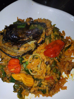 A picture of Palm oil jallof rice with Dry Fish.