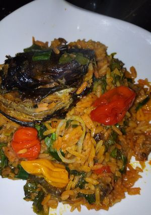 A picture of Palm oil jallof rice with Dry Fish.