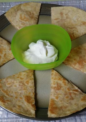 A picture of Chicken/Cheese Quesadilla.