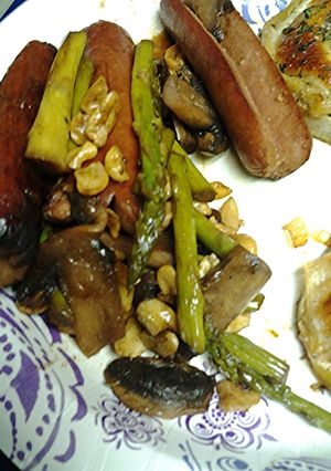 A picture of Asparagus, mushrooms cashews and splitdogs.