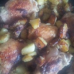 A picture of Pan fried chicken and garlic potatoes.