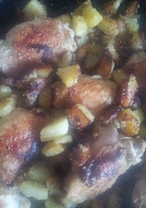 A picture of Pan fried chicken and garlic potatoes.