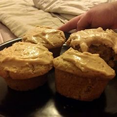 A picture of peanut butter cupcakes with peanut butter frosting.