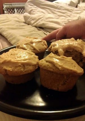 A picture of peanut butter cupcakes with peanut butter frosting.