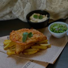 A picture of Fish & Chips with Tartar Sauce & Mushy Peas.