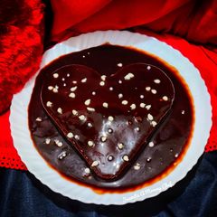 A picture of Eggless Vanilla cake with hot chocolate sauce.