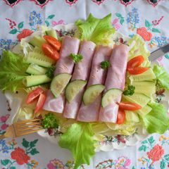 A picture of Ham rolls filled with mushrooms.