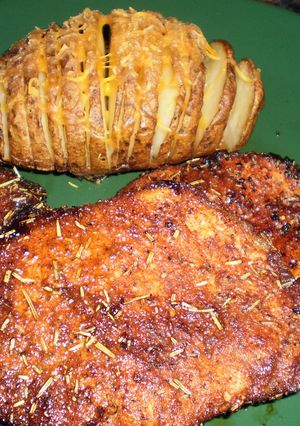 A picture of Rosemary fan potato and pork chop.