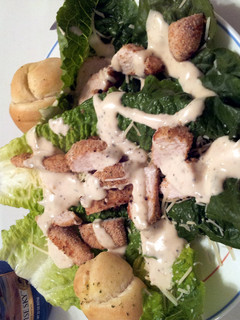 A picture of Parmesan crusted chicken Cesar salad.