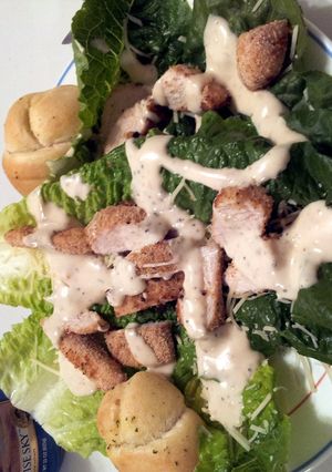 A picture of Parmesan crusted chicken Cesar salad.