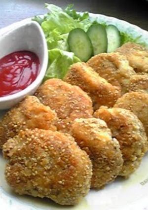 A picture of White Sesame & Cheese Coated Chicken Breast Cutlets.