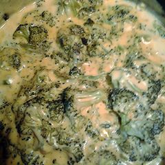 A picture of cheesy broccoli.