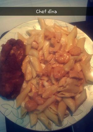 A picture of Pasta with pink sauce.