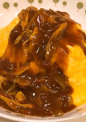 A picture of Fluffy and Creamy Omurice with Demi-Glace Sauce.