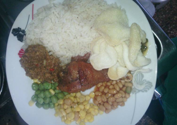 Fresh White Rice and Abykahuna Sauce with peppered saulted baked beans,sweet corn and green peas with driz