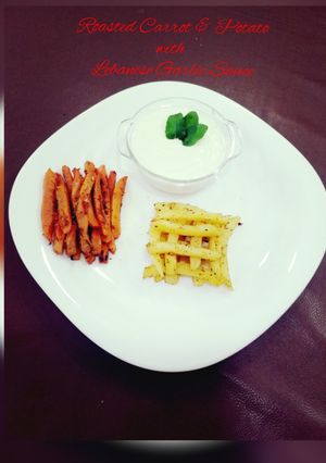 A picture of Roasted Carrots & Potatoes with Homemade Lebanese Garlic Sauce(toum).
