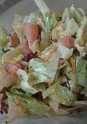 A picture of Hotdogs and salad.