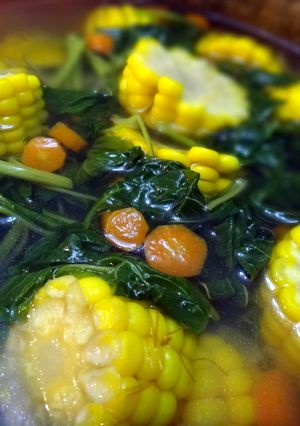 A picture of Sayur Bayam (healthy spinach and corn soup).