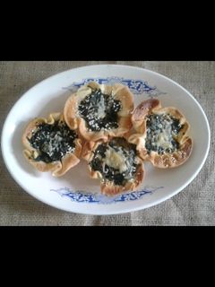 Una foto de Canastitas de cebollas y espinacas
