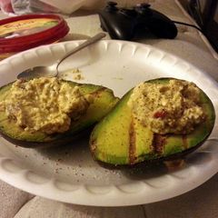 A picture of Grilled Avocado with Spinach Feta Hummus.