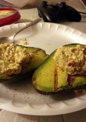 A picture of Grilled Avocado with Spinach Feta Hummus.