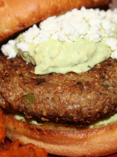 A picture of Turkey-Quinoa Burgers with an Avocado-Yogurt Sauce.