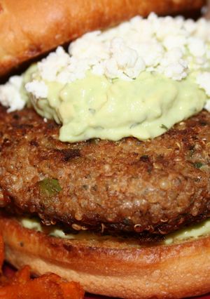 A picture of Turkey-Quinoa Burgers with an Avocado-Yogurt Sauce.