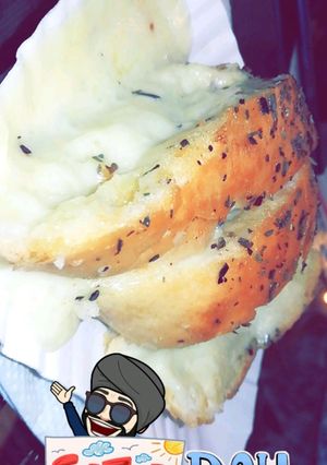A picture of Garlic bread with cheese.