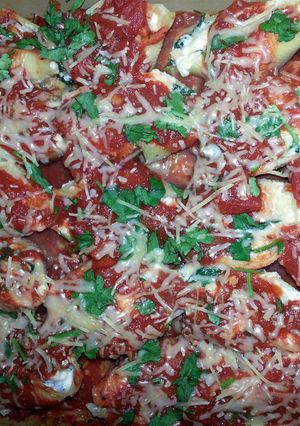 A picture of spinach & cheese stuffed shells.