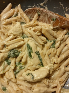 A picture of Chicken & Spinach Alfredo.