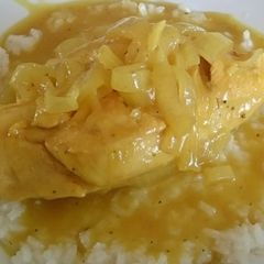 A picture of CHICKEN WITH MUSTARD SAUCE ON A BED OF WHITE RICE.